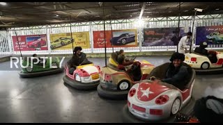 Afghanistan: Taliban militants enjoy bumper cars in Kabul