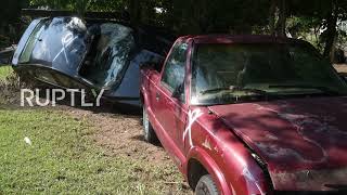 USA: Waverly residents clean up streets in aftermath of catastrophic floods