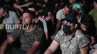 Iraq: Election protesters pause demonstration to watch Real Vs Barcelona in Baghdad