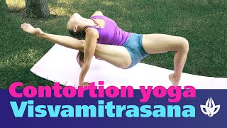 Contortion yoga. Leg behind back. Visvamitrasana.