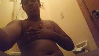 Chubby black boy play ing with belly