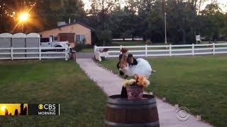Watch: Groom trips while carrying bride and crashes onto sidewalk