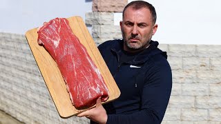 FRYING A BIG CHUNK of MEAT on a FRYING PAN.