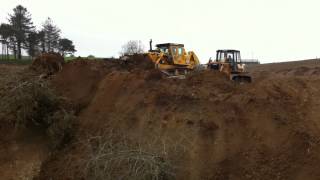 Cat D9H and Komatsu D58P-1