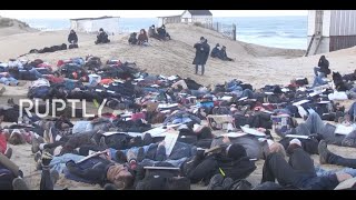 France: Die-in staged on Calais beach in protest over Channel crossing migrant deaths