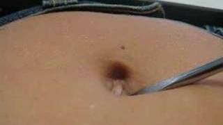 Belly button poke and rub using a big screwdriver !!
