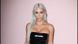 Kim Kardashian Rocks Skintight Black Latex Dress & Silver Blonde Hair At Tom Ford NYFW Show