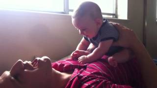 Noah sitting on daddy's chest