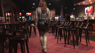 Snakeskin thigh boots at the bar