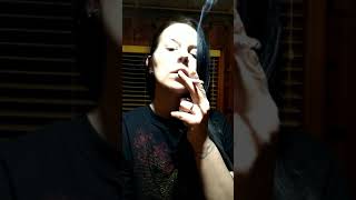 Woman smoking white cigarette