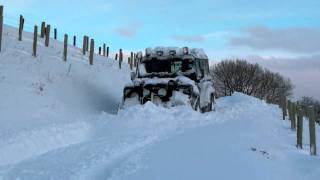 Land Rover ploughing snow