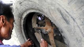 วิธีตัดขอบยางด้วยเครื่อง ง่ายๆสบายๆ จากตาเฉลิม(บ้านดงบัง) Home made tyres cutting.