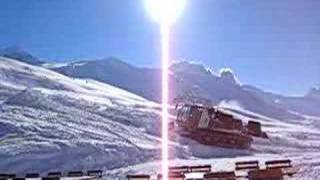 Piste grooming machine in action