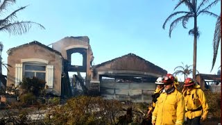 California crews search for victims as wildfires burn on