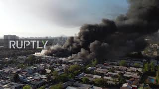 Chile: Drone shows heavy smoke billowing above Macul following fire