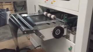 TTF-520AF plastic thermoforming machine for making coffee cup lids with double holes in Romania.