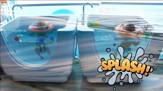 Triplets' first swimming lesson