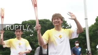 Japan: Sparks fly as Tokyo's Paralympic flame relay ends