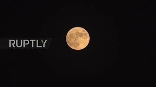 Iran: "Hunter"s Moon" bathes Tehran in orange glow