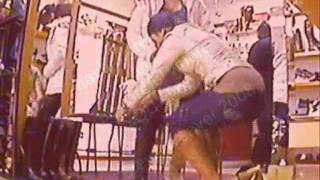 pregnant womans water breaks in a shoe shop while shoes being fitted