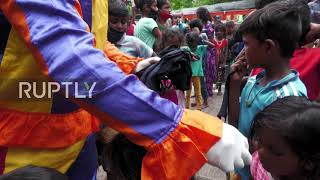 Indian clown educating disadvantaged kids teaches them that COVID is no small feat