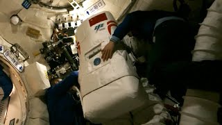 CSS astronauts unpack EVA spacesuit