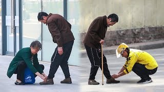 When an old man has trouble tying his shoes, what will passers-by do? 社会实验：当路人在街头看到他后，有人主动弯下腰…