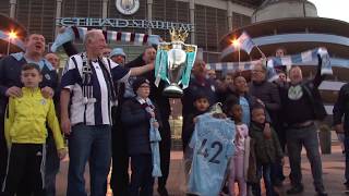 Manchester City fans celebrate winning the Premier League title