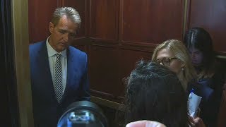 'Look at me': Emotional protesters confront Sen. Jeff Flake