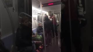 Girl gets the taste slapped out of her mouth by guy on NYC train!!