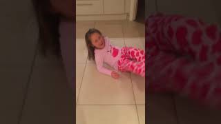 Vibes  english girl in pink shirt runs across wet floor and slips in kitchen