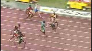 Gay chases down Powell for 100-meter gold