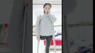 Chinese LAK amputee one leg girl on double crutches